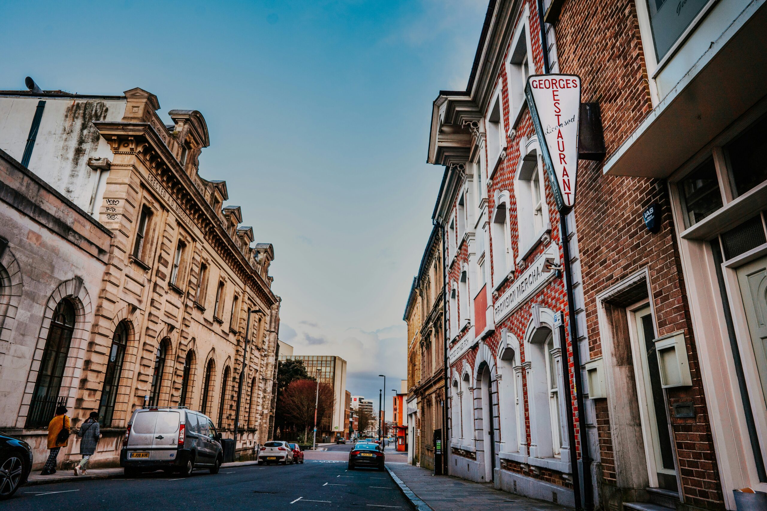 street in Southampton with parked vans and old buildings.