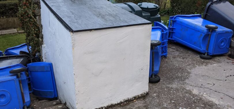 wheelie bins blown over in a storm.