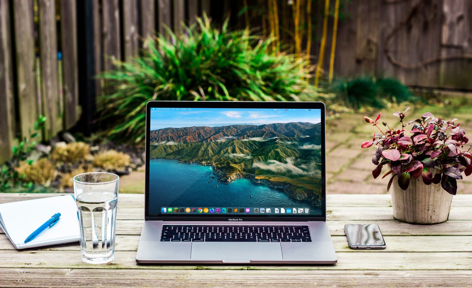 laptop on a table in the garden.