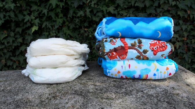 two piles of nappies on grass.
