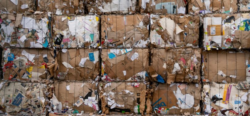cardboard bales stacked on top of each other.