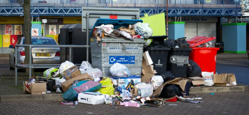 overflowing commercial bins