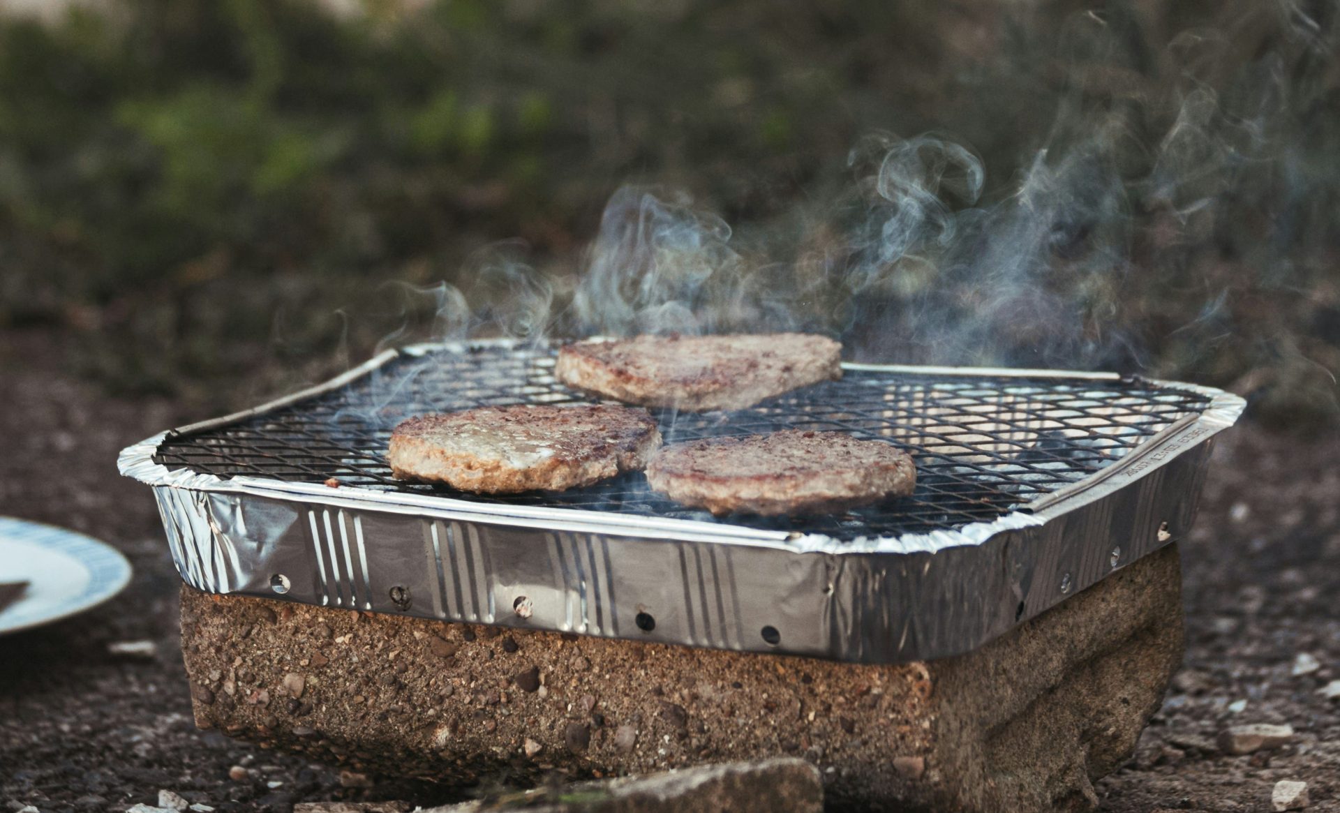 disposable bbq with burgers